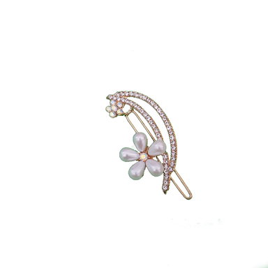 گیره دخترانه مدل گل نگین دار رنگ طلایی