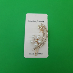 گیره دخترانه مدل گل نگین دار رنگ طلایی