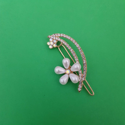 گیره دخترانه مدل گل نگین دار رنگ طلایی