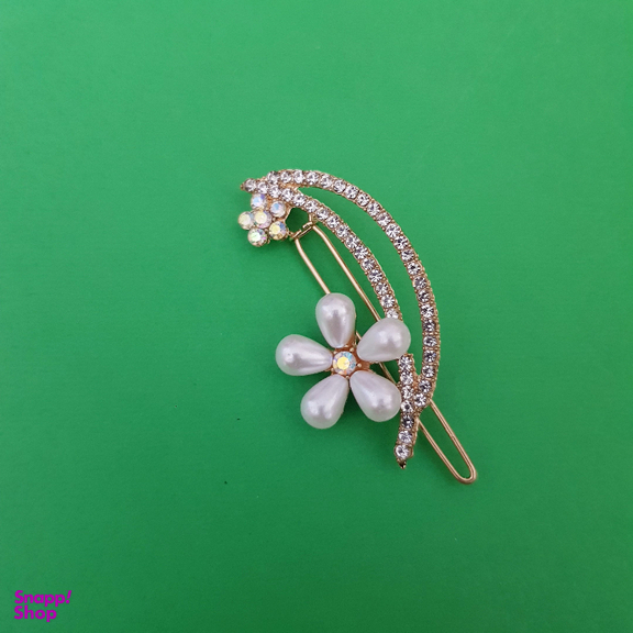 گیره دخترانه مدل گل نگین دار رنگ طلایی
