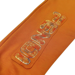 شلوار نوزادی به آوران طرح هورام رنگ نارنجی