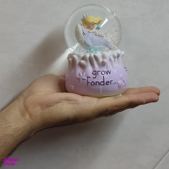 گوی موزیکال مدل چراغ دار طرح فرشته کوچولو و دریا