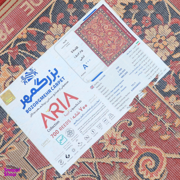 فرش ماشینی 700 شانه بزرگمهر مدل بلوچی کد 78015 زمینه قرمز حاشیه لاکی