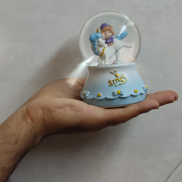گوی موزیکال مدل چراغ دار طرح پسرک و اسب تک شاخ