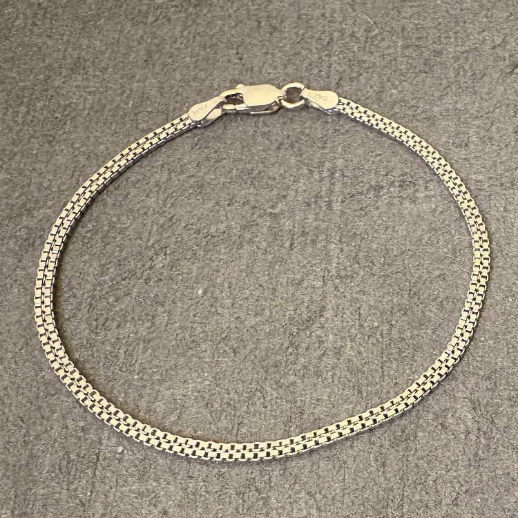 دستبند نقره زنانه گیرا مدل G0581 طرح بافت